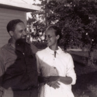 Ross L. and LuLu Talbot by old farm house